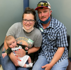 Adrianne with her husband and son, Silas.